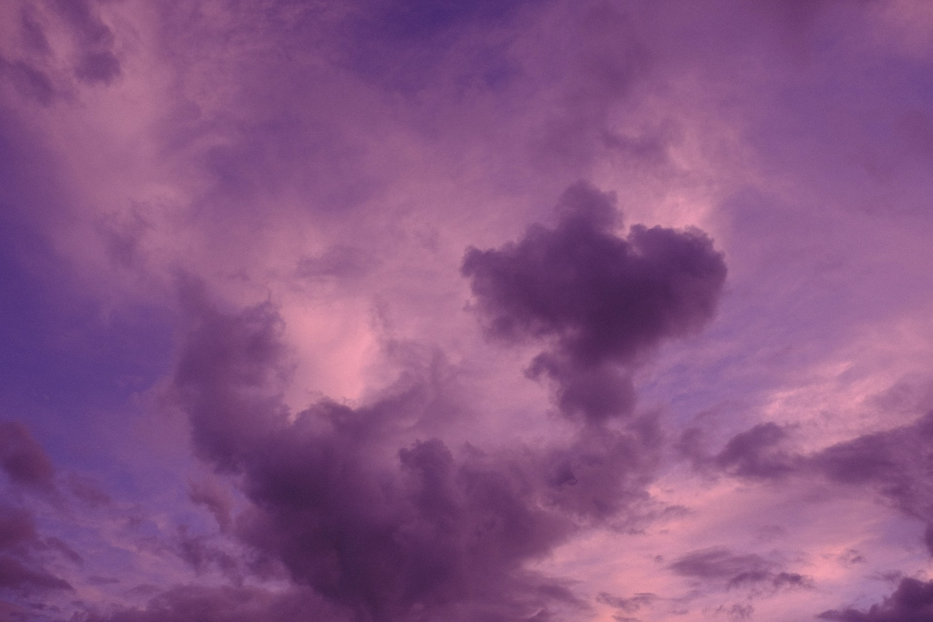 a purple sky filled with lots of clouds