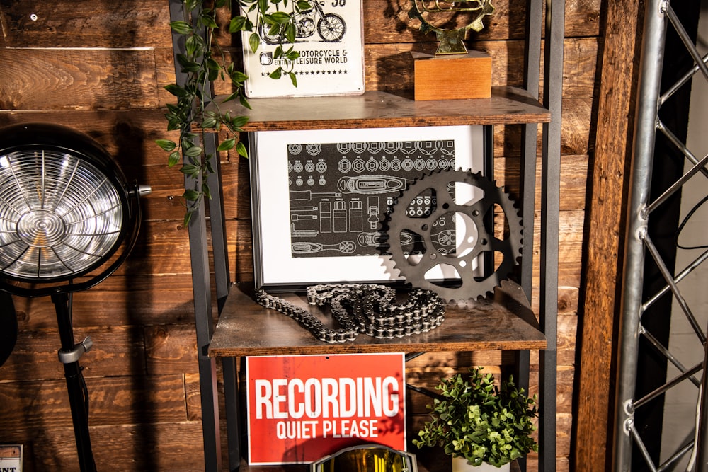 a shelf with a clock and a sign on it