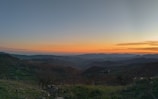 An expansive view of a scenic off-road landscape at sunset.