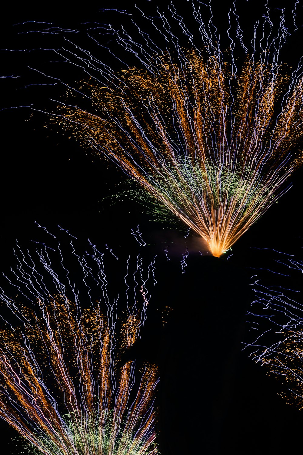 a bunch of fireworks are lit up in the night sky