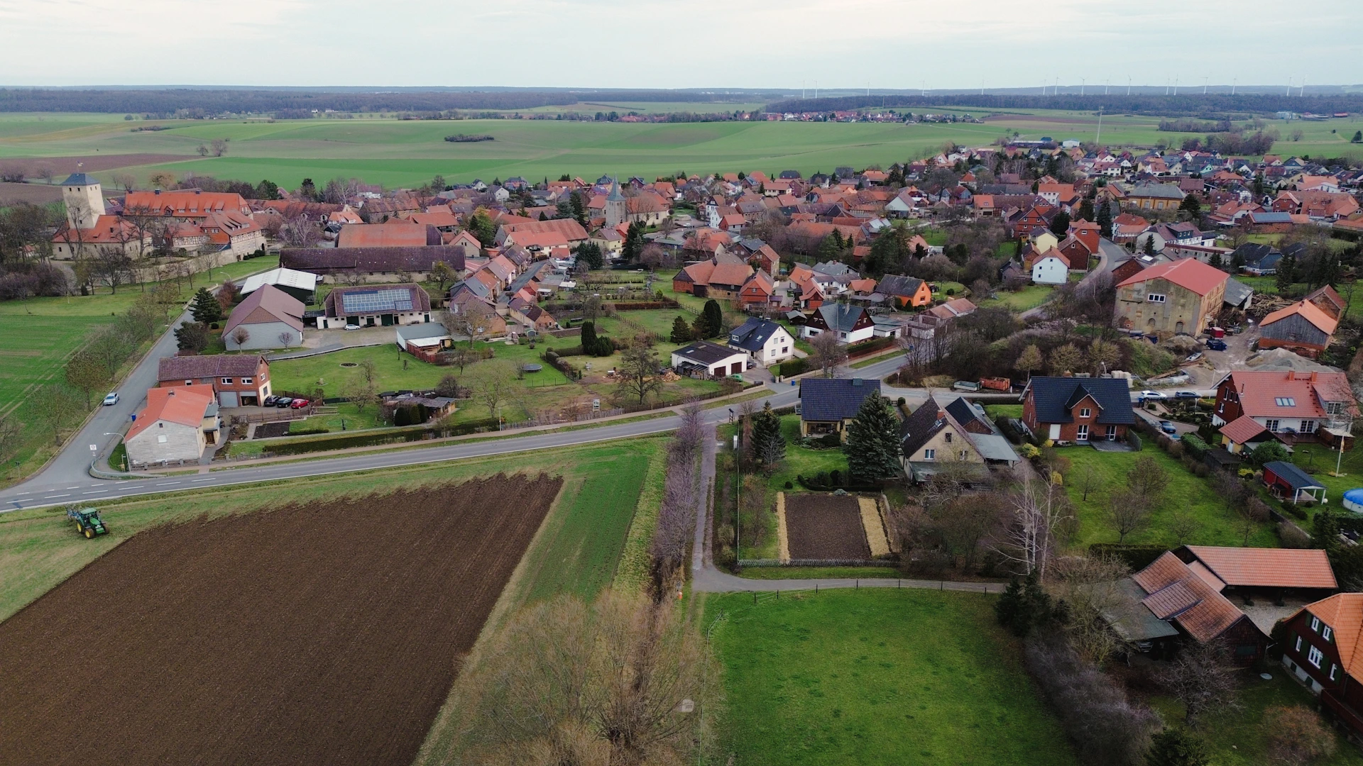 an aerial view of a small town with lots of houses