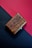 A close-up of a beautifully engraved wooden keepsake box.