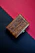 Close-up of a beautifully engraved wooden gift box with a sleek corporate logo.