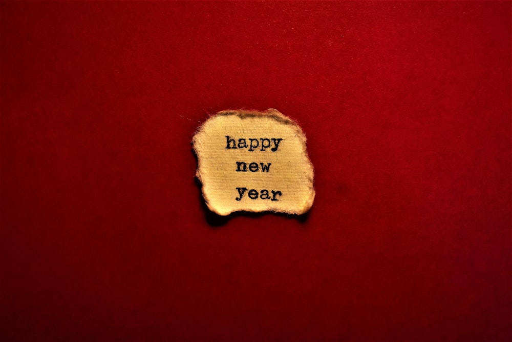 a piece of paper that says happy new year on it