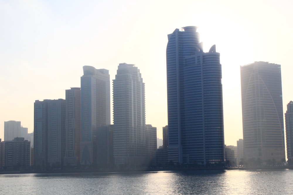 a large body of water in front of tall buildings