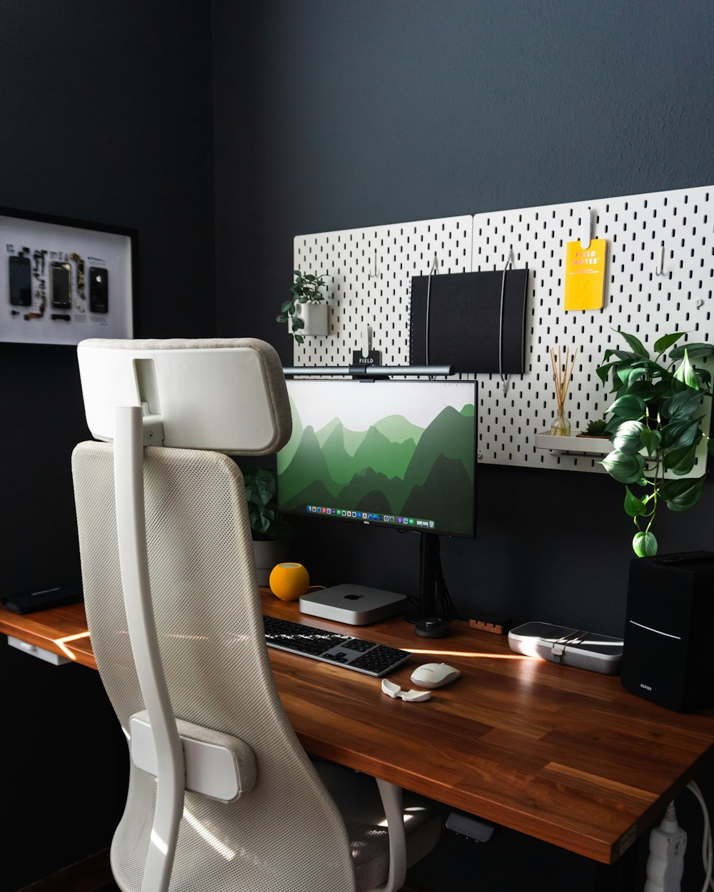 a desk with a computer monitor and keyboard on it