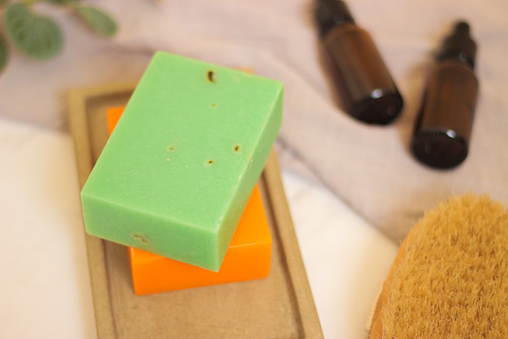 a close up of soap and a brush on a table
