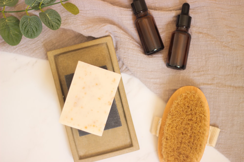 a close up of a hair brush and a soap