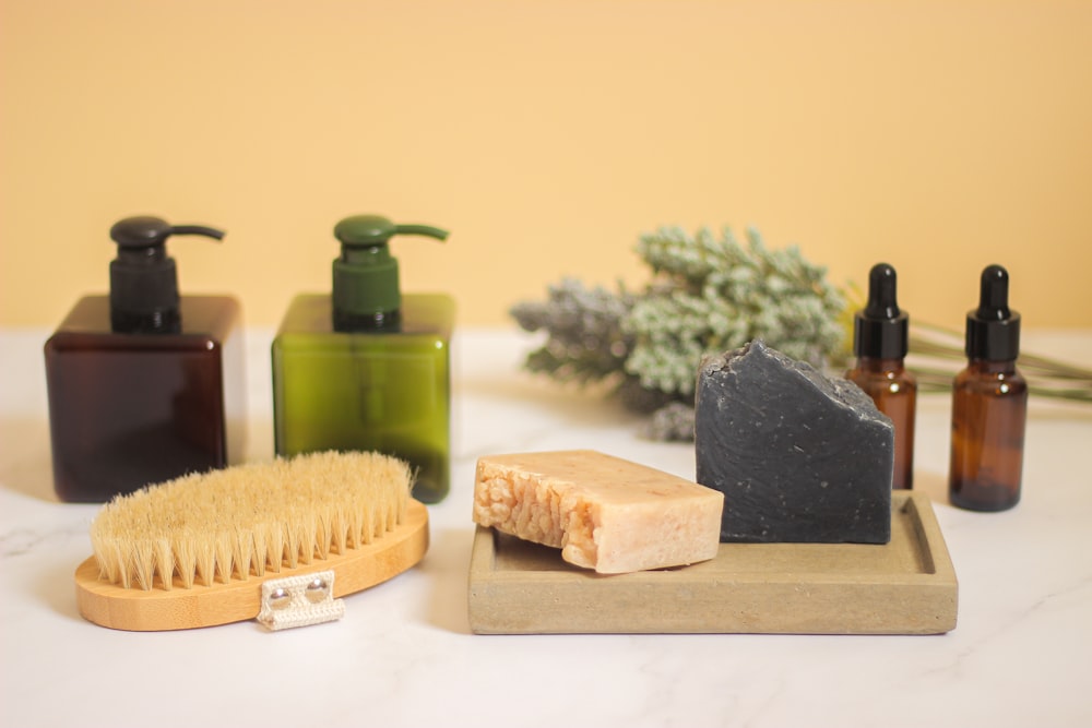 soap, soap brush, and soap dish on a counter