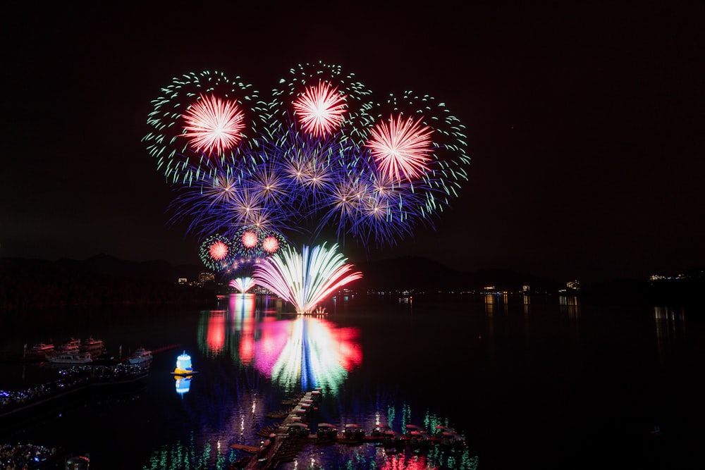 a large fireworks display over a body of water