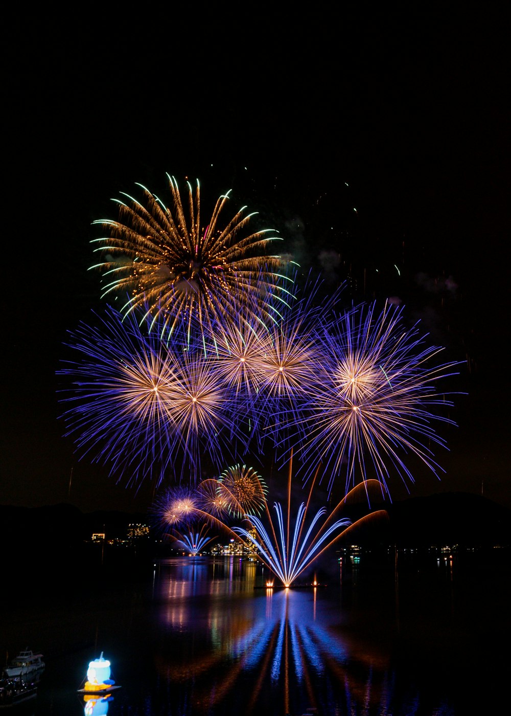 a large group of fireworks are lit up in the night sky