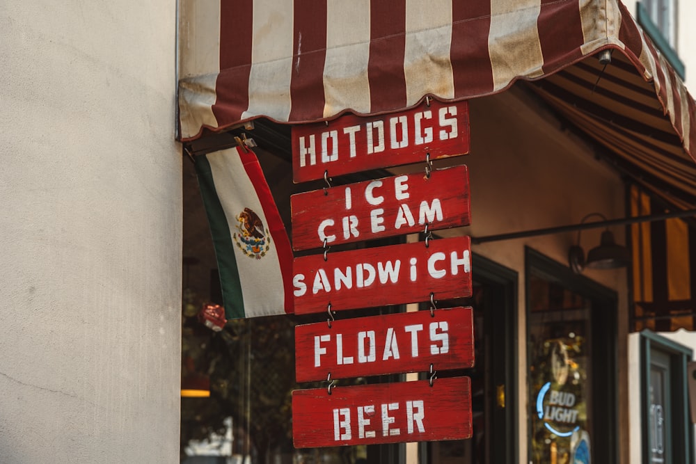 a sign that says hotdogs ice cream sandwich floats beer
