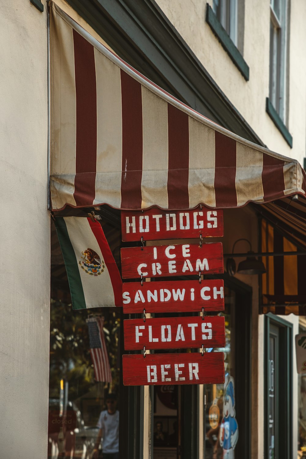 a red and white awning on a store front