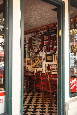 Retro diner counter with a vintage phone and burger menu on the wall.