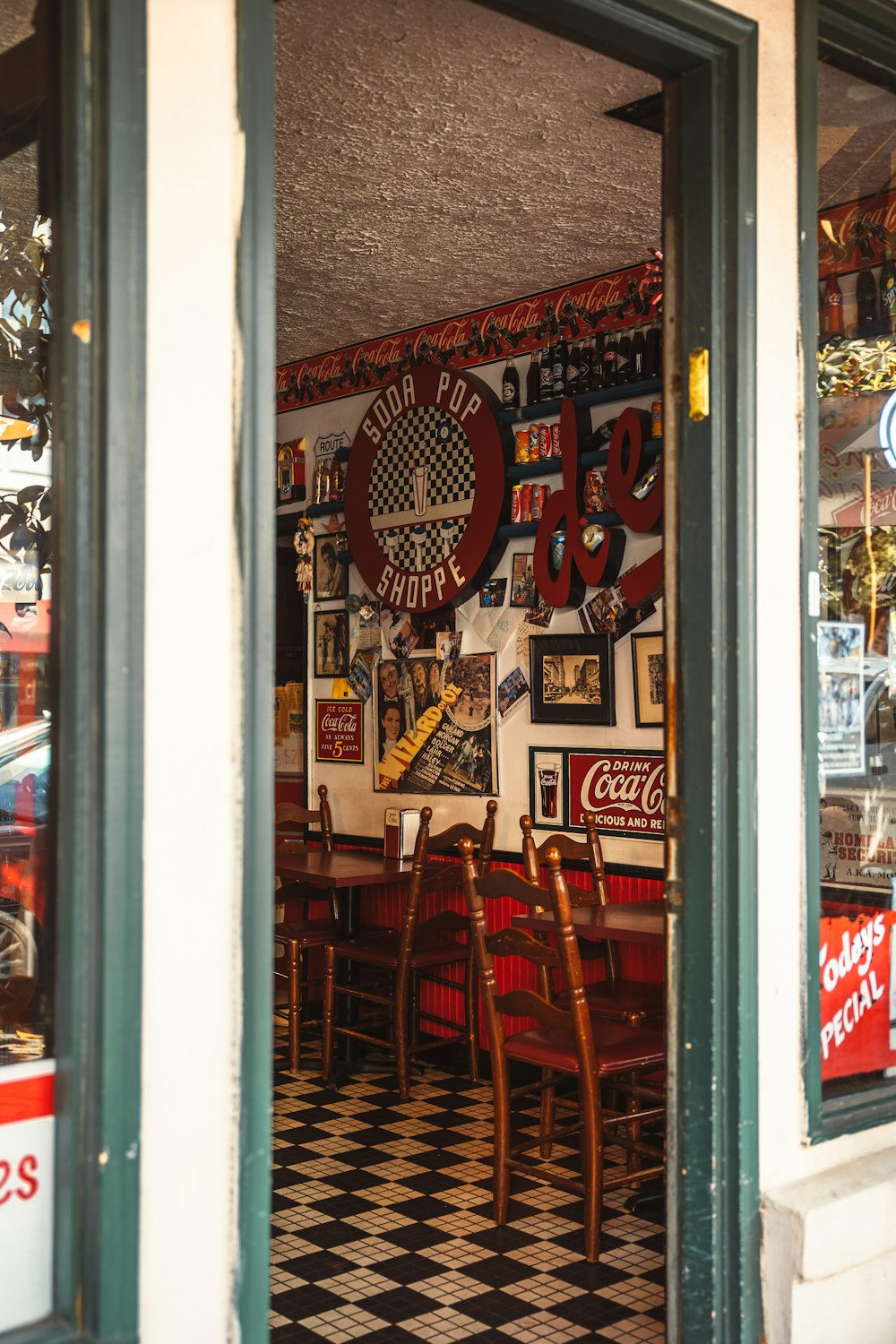 a restaurant with a checkered floor and a checkered floor