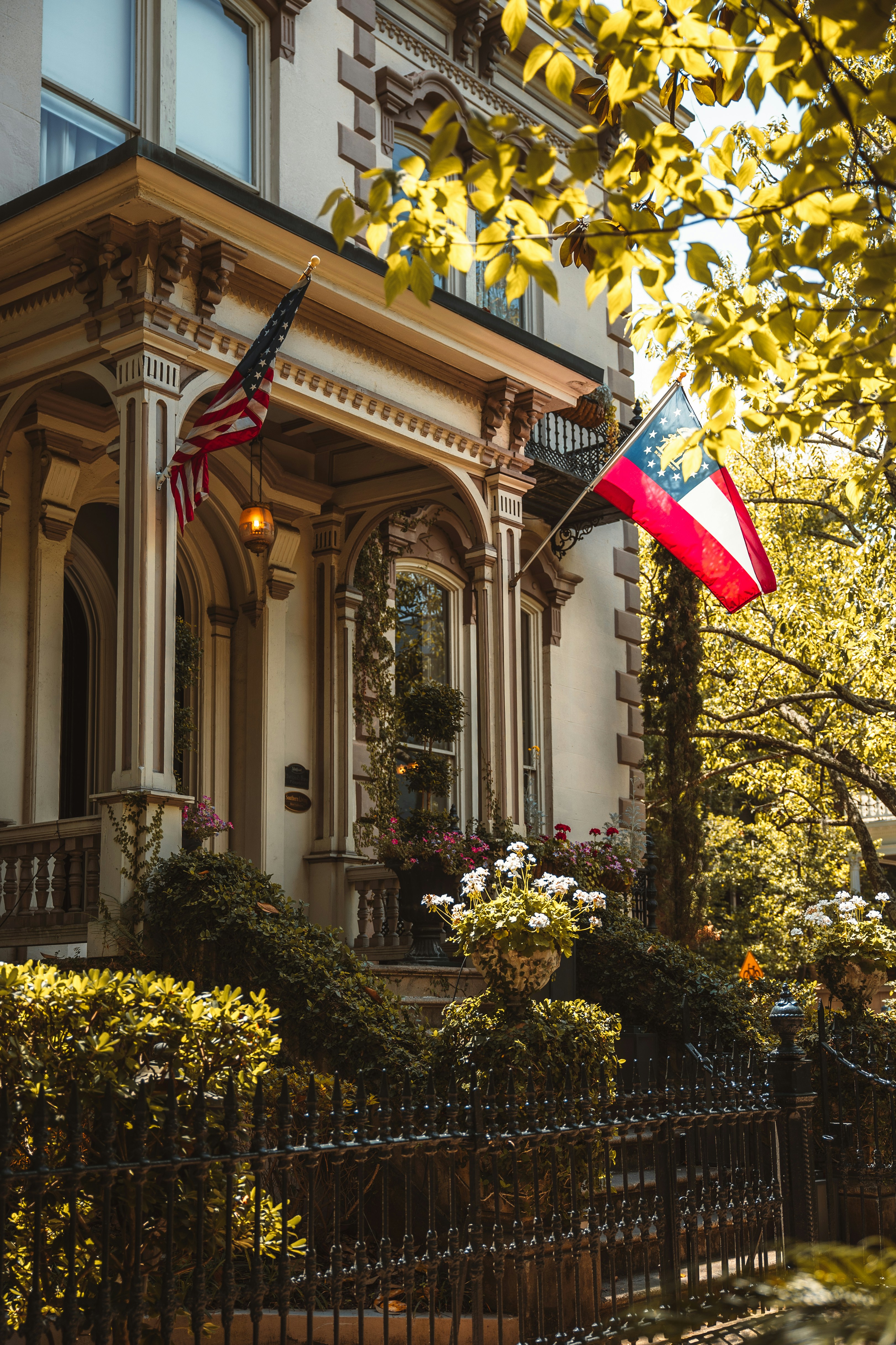 an american flag flying in front of a house