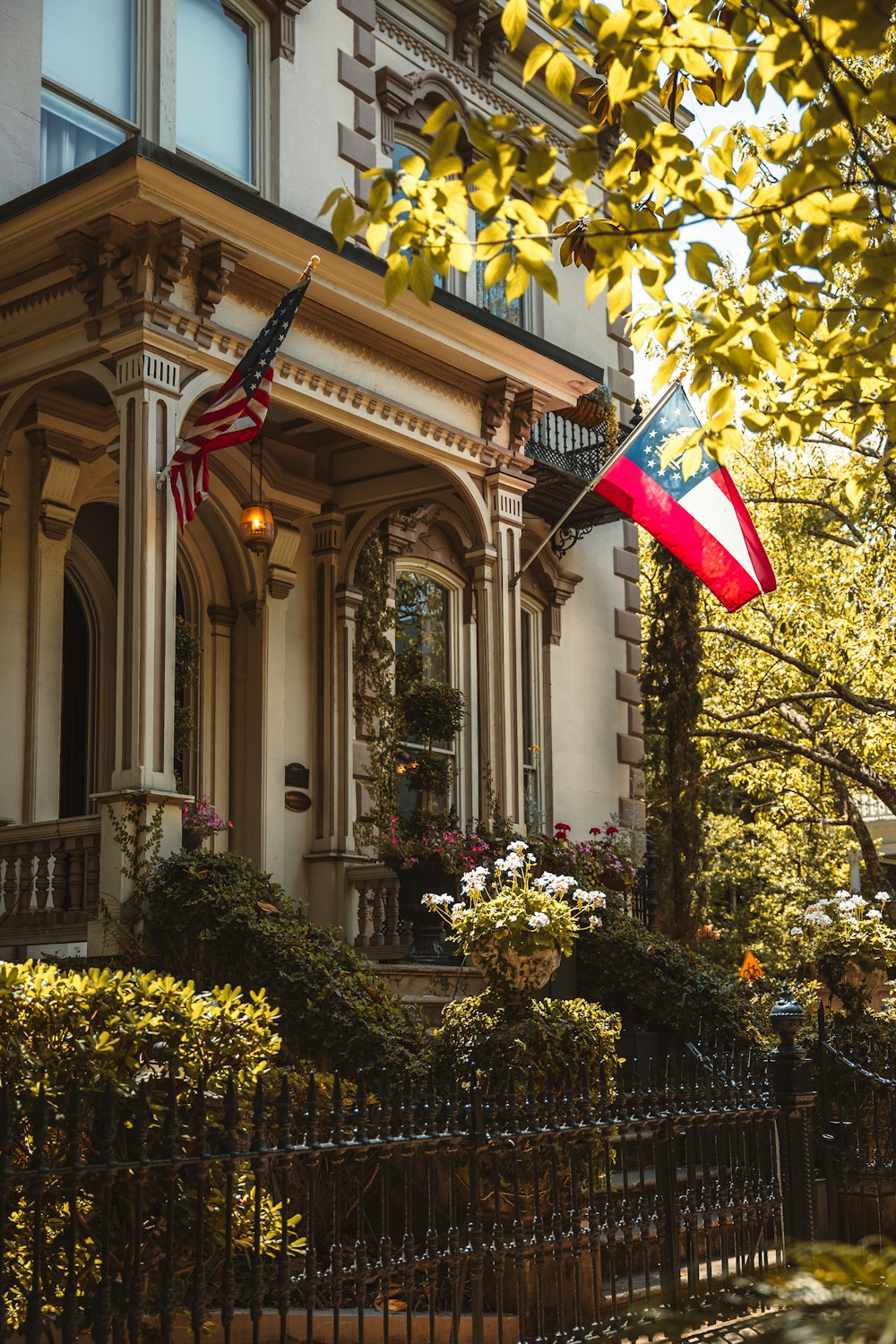 an american flag flying in front of a house