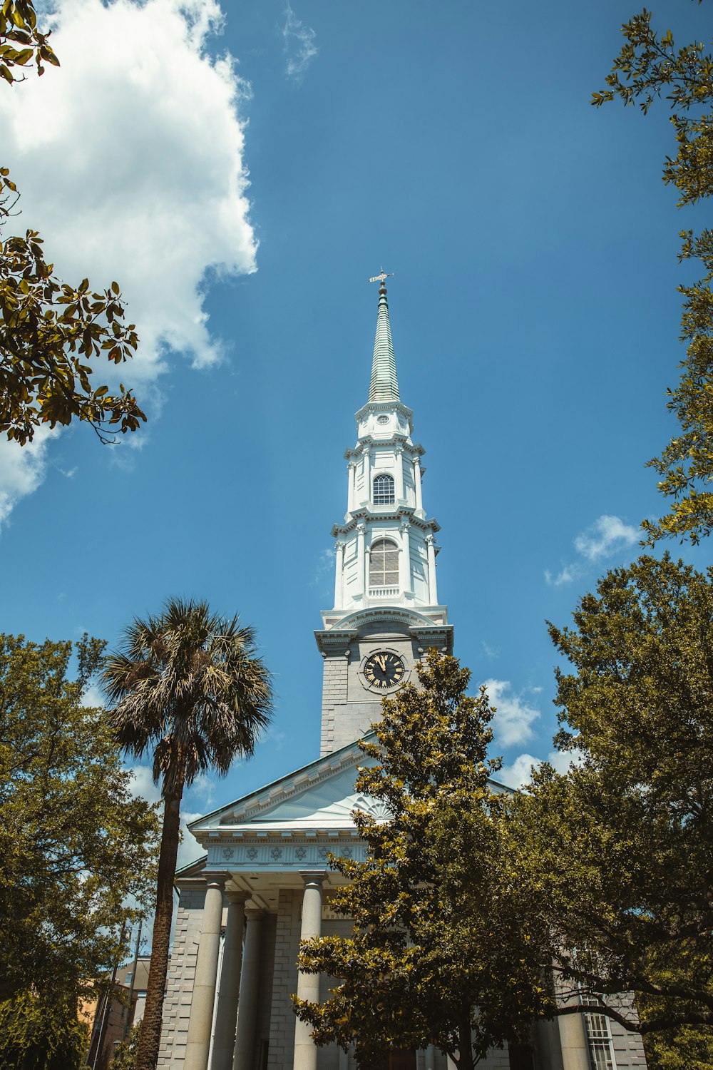 a church steeple with a clock on it