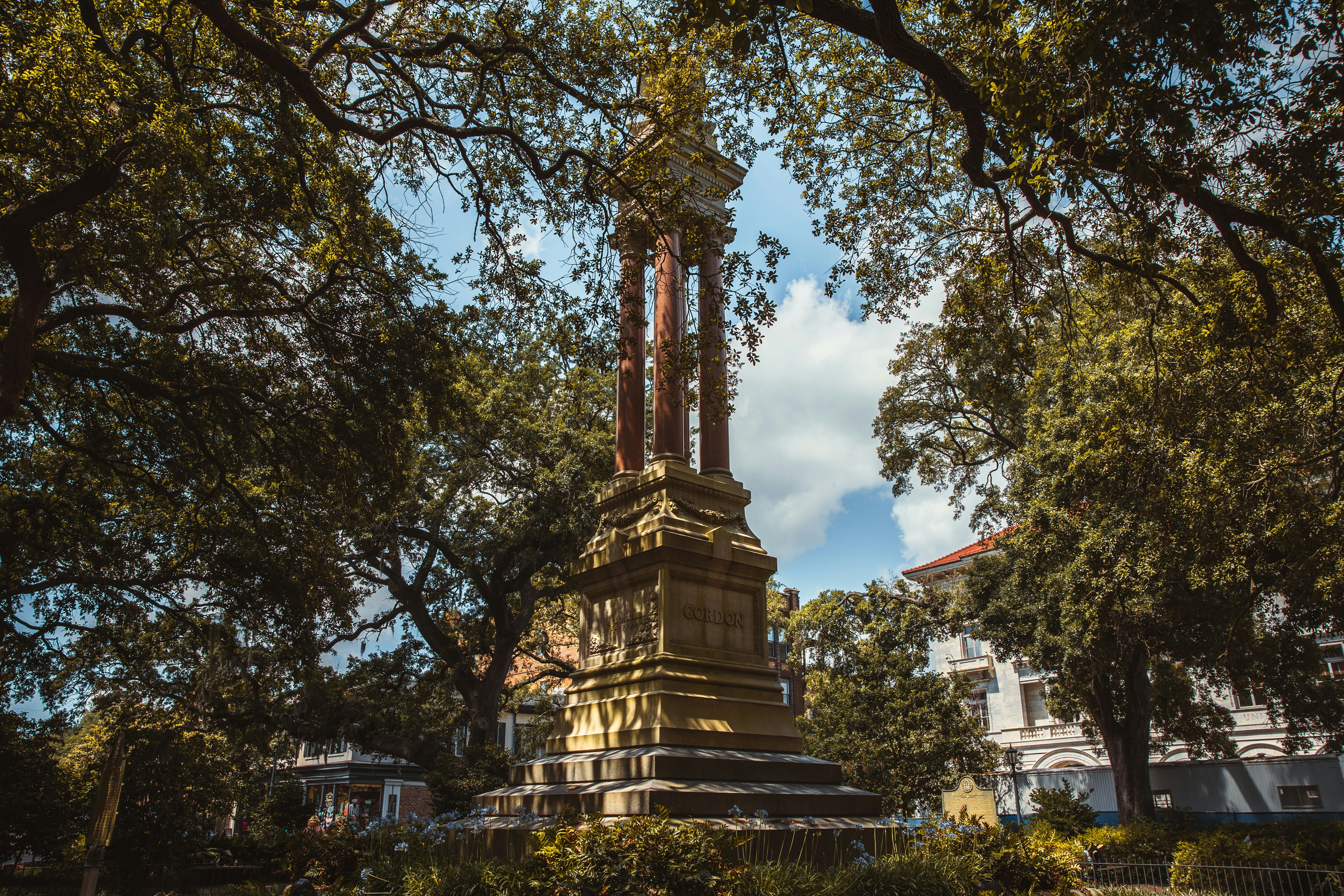 a clock tower in the middle of a park, 