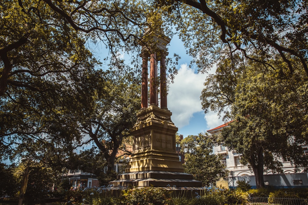 a clock tower in the middle of a park