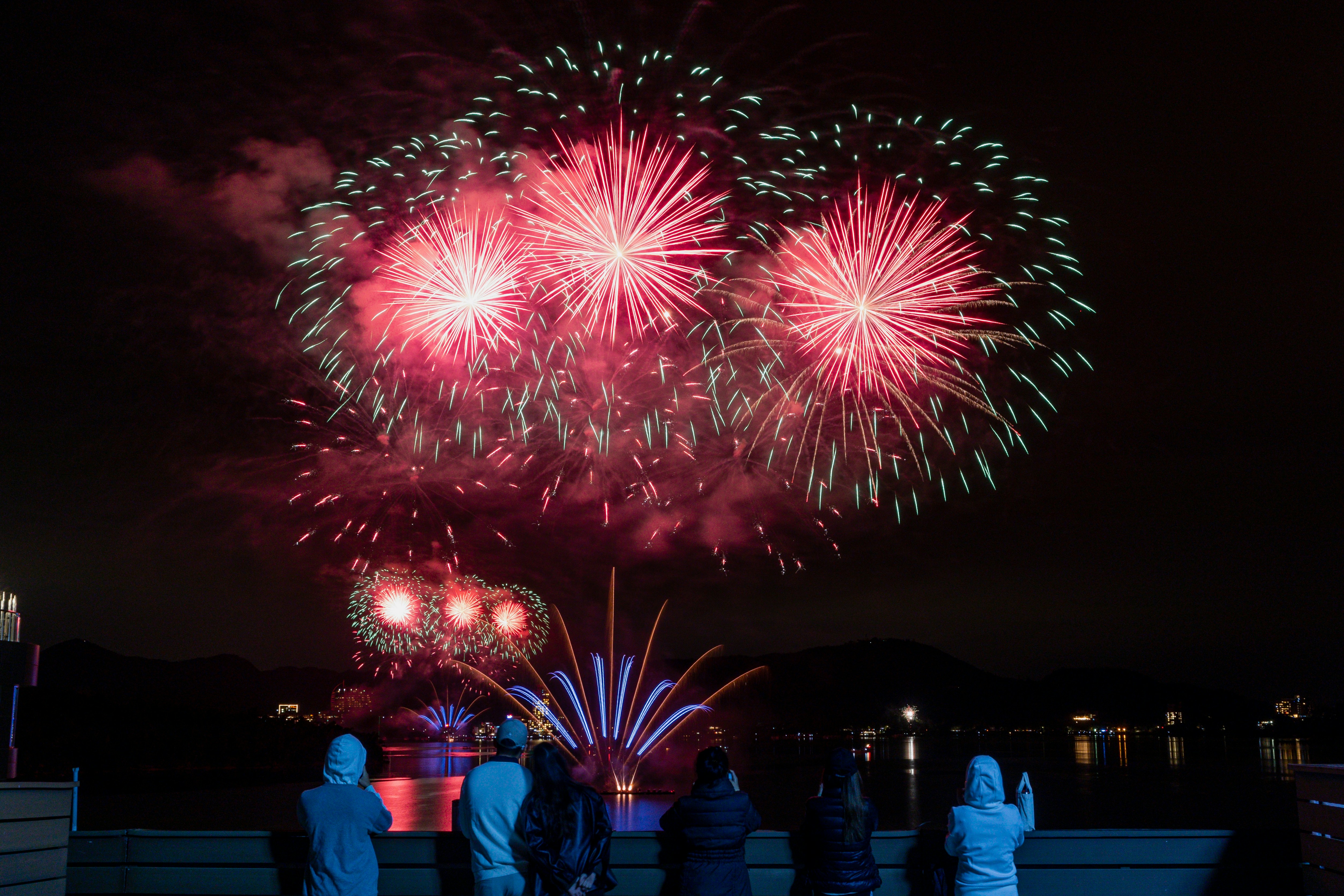 a group of people watching a fireworks display
