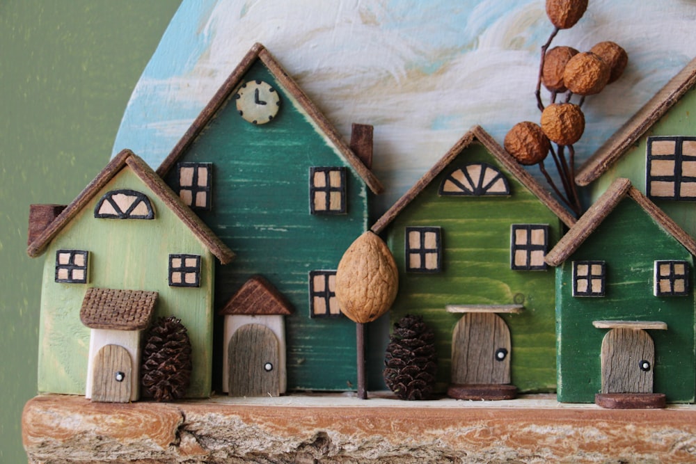 a close up of a group of houses on a shelf