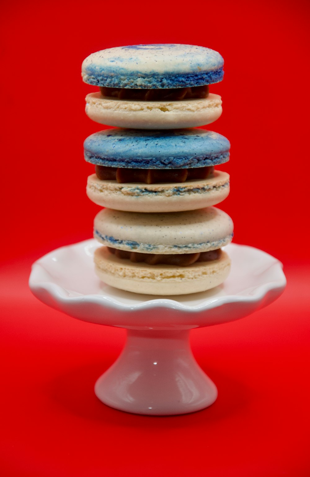 a stack of cookies sitting on top of a white plate
