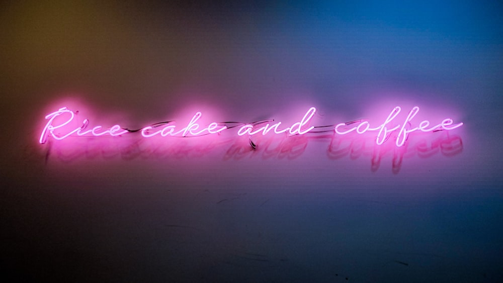 a neon sign that reads roses and coffee