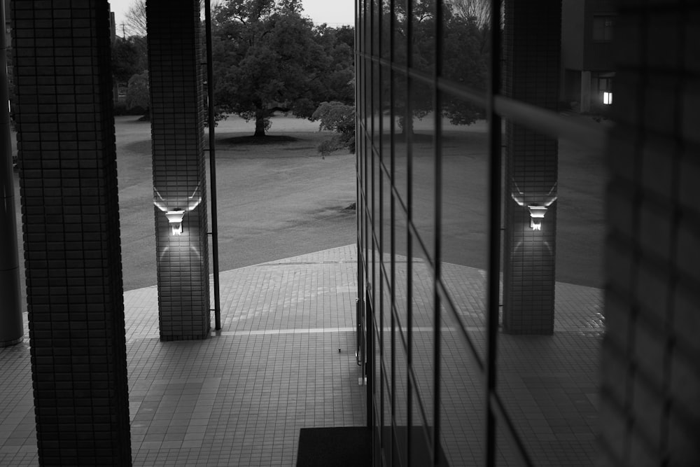 a black and white photo of two toilets in a room