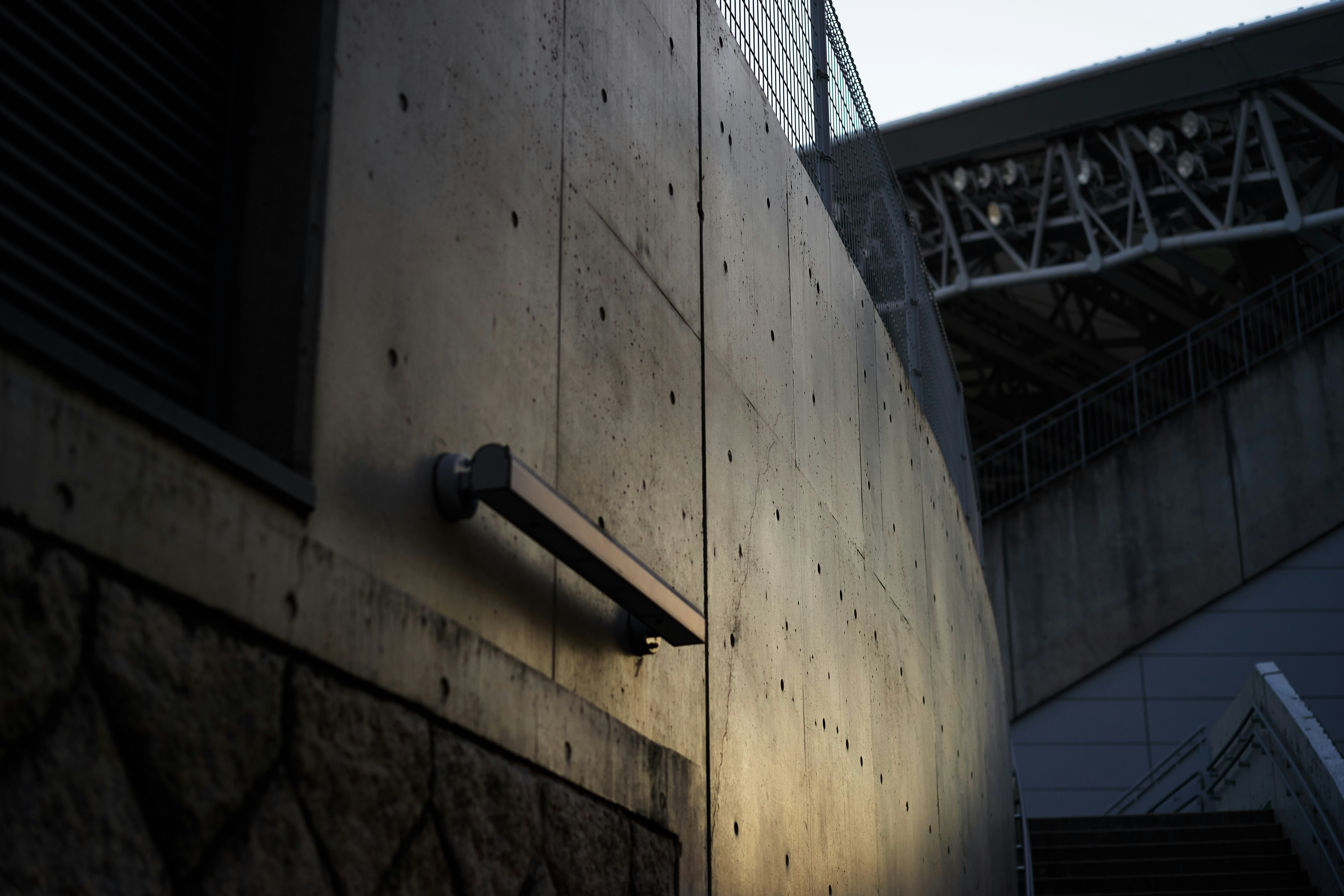 a security camera mounted to the side of a building