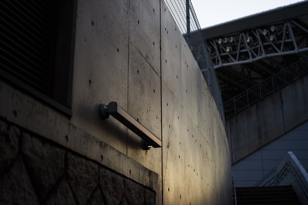 a security camera mounted to the side of a building