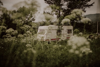 A scenic view of a caravan parked in a beautiful landscape.