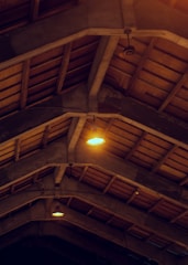 Interior view of a barndominium showing exposed beams and modern farmhouse decor.