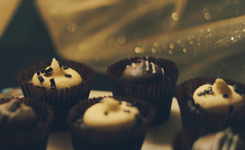 a close up of a plate of cupcakes