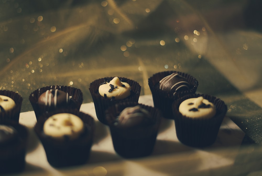 a group of chocolates sitting on top of a white plate