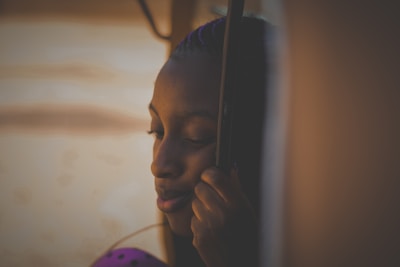 A peaceful scene of a person reflecting calmly with soft natural light.