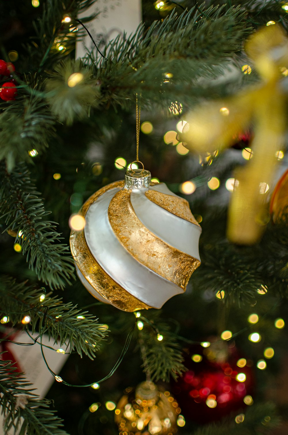 a close up of a christmas tree with ornaments