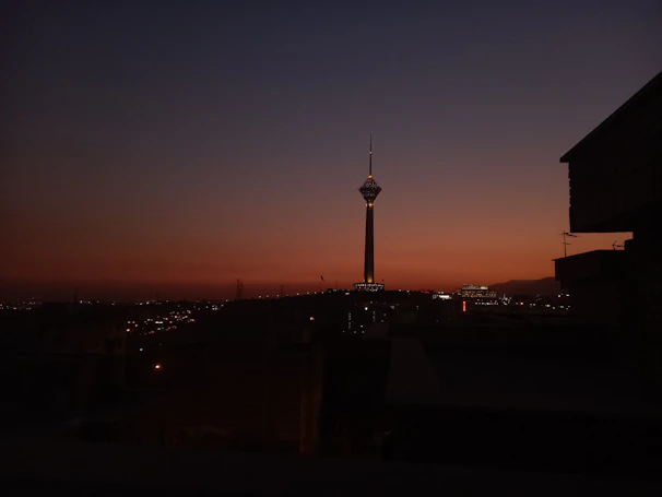 A sleek city skyline at dusk, symbolizing stability and growth under a deep navy sky.