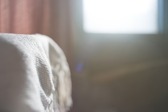 A serene view of the one of silk atelier in Istanbul, bathed in soft natural light highlighting delicate silk pieces.