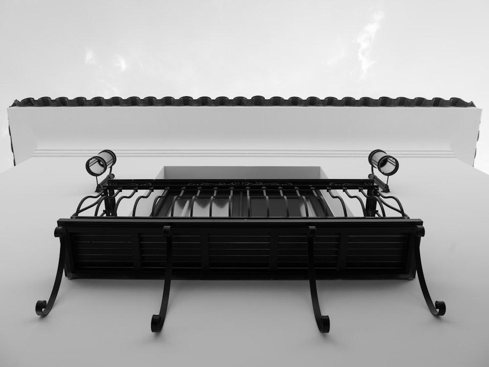 a black and white photo of a grill