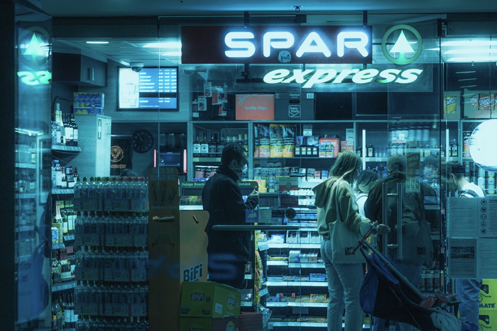 a group of people standing in front of a store