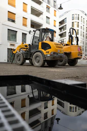 a construction vehicle parked in front of a building