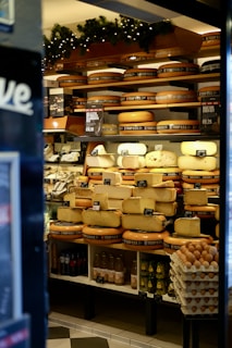 a display case filled with lots of cheese