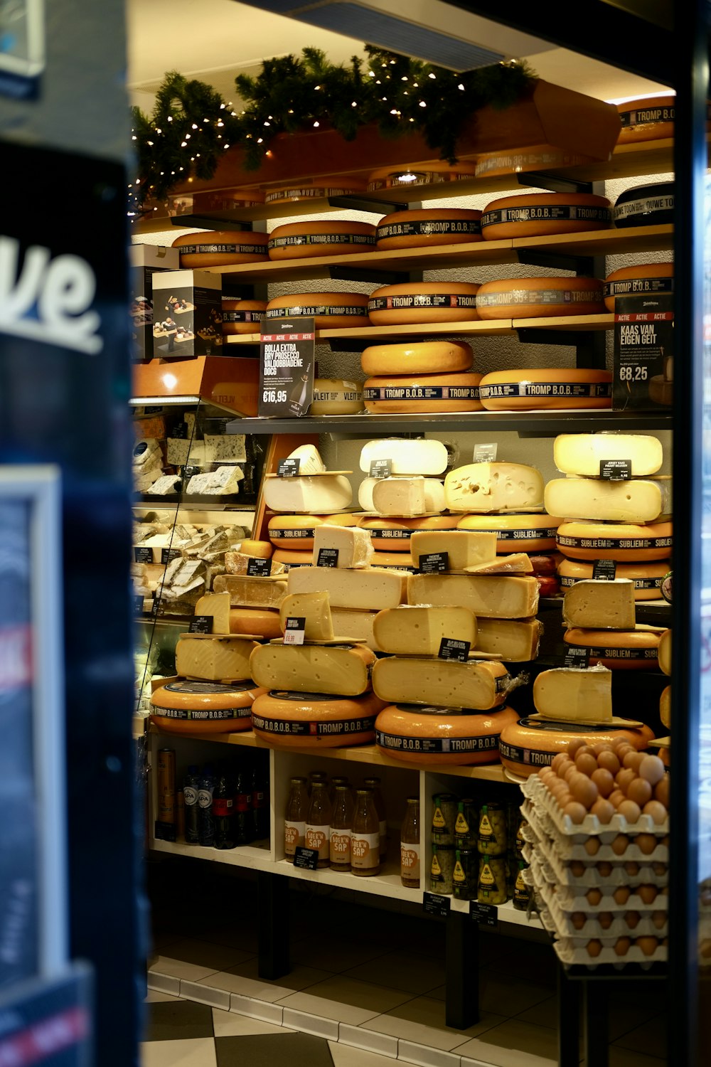 a display case filled with lots of cheese