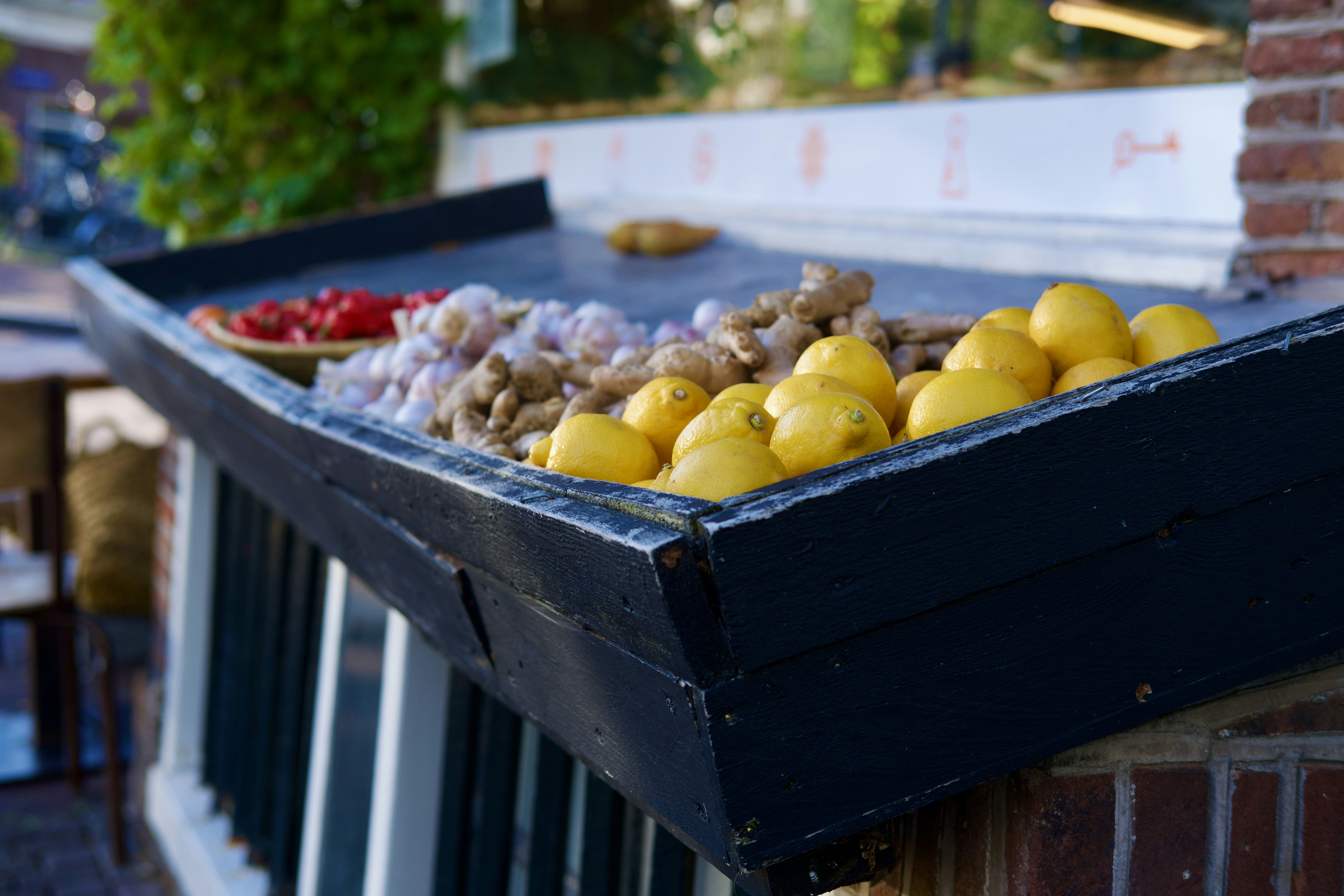 a bunch of lemons and other fruits on a table