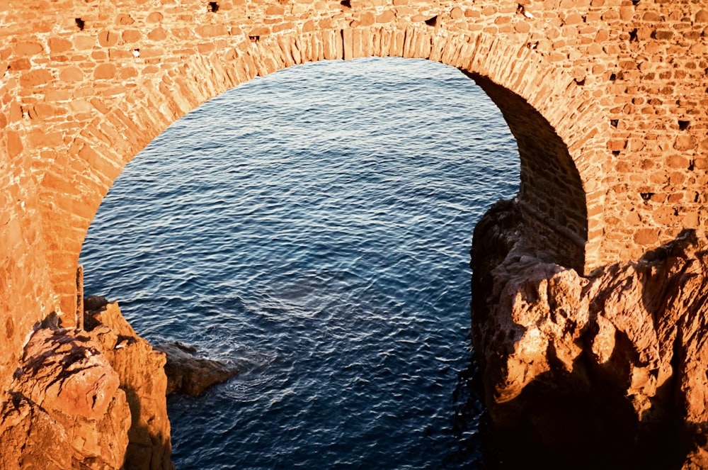 a stone bridge over a body of water