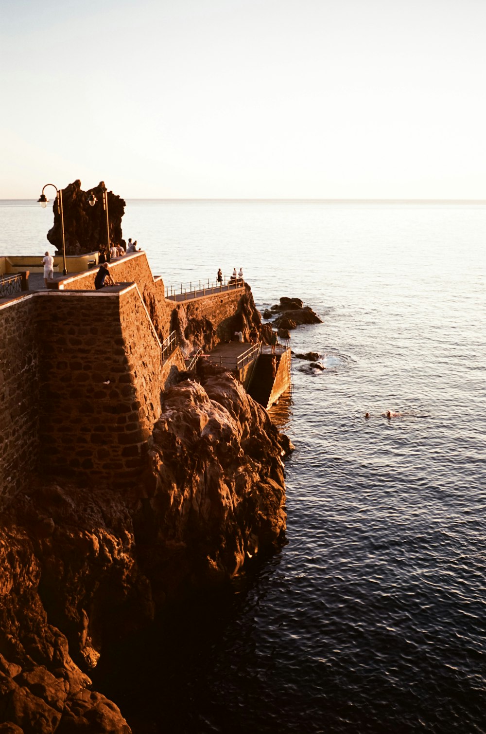 a view of a body of water from a cliff