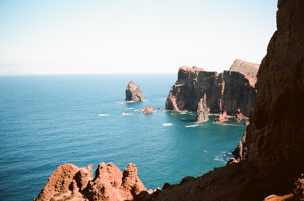 a large body of water surrounded by rocks