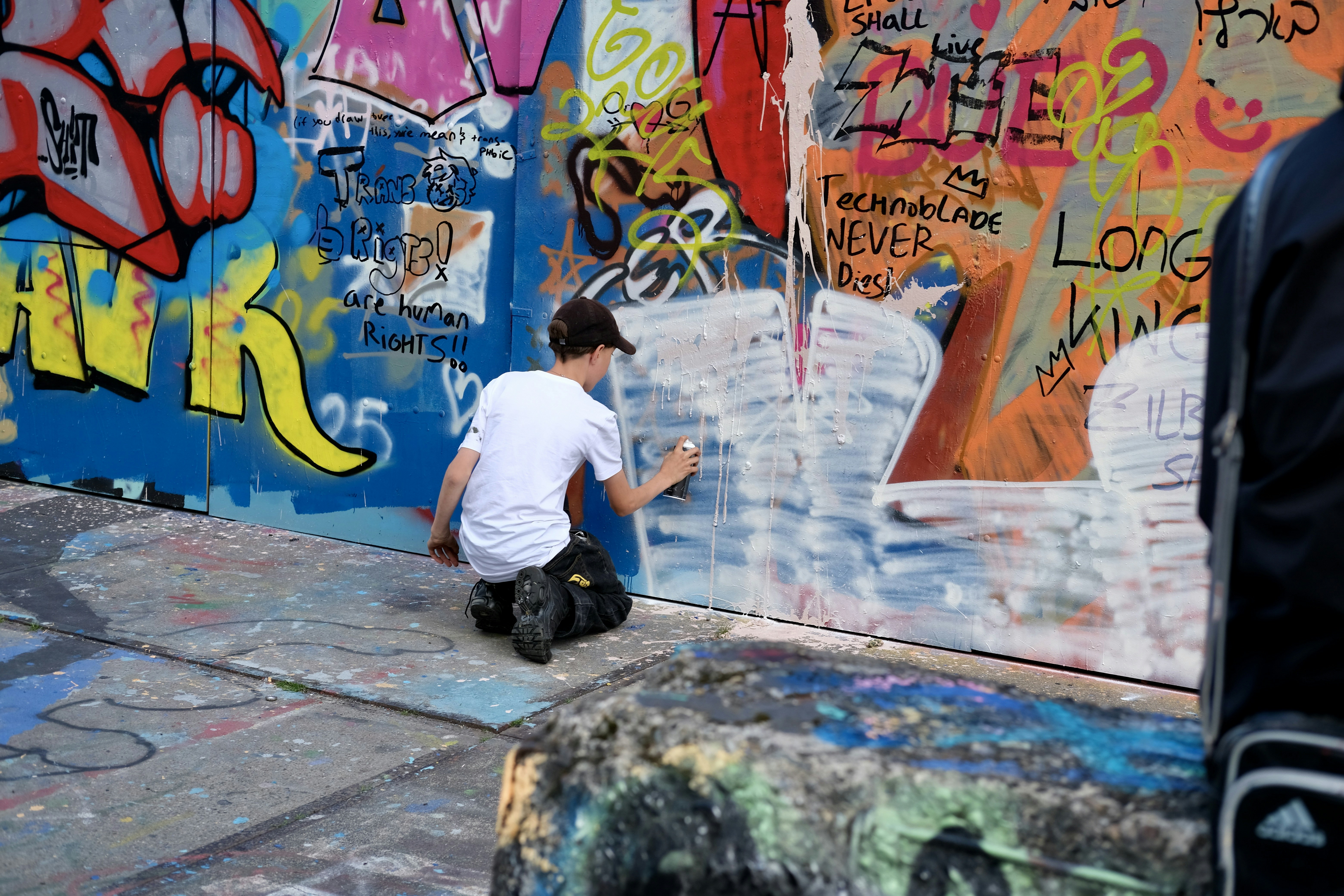 Teens exploring a cool graffiti laneway in Melbourne