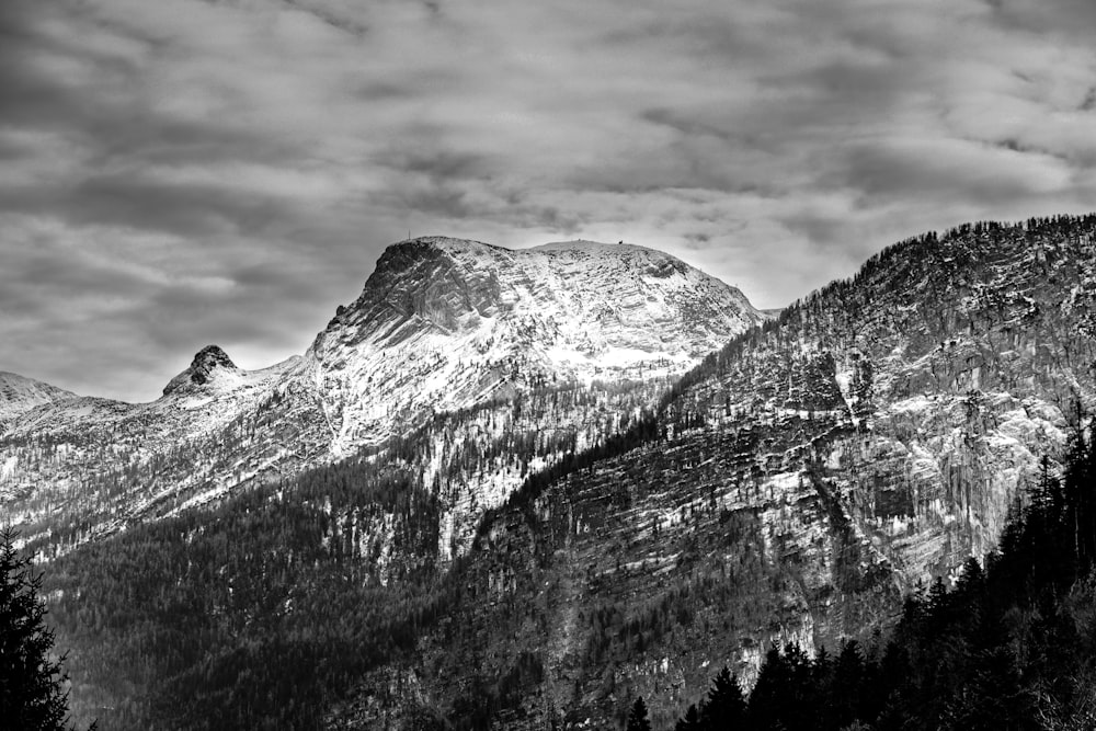 a black and white photo of a mountain range